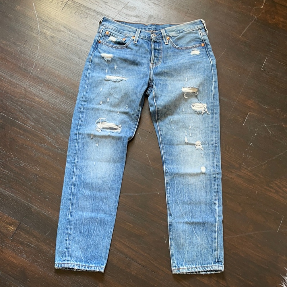Levi’s 501 tapered distressed jeans